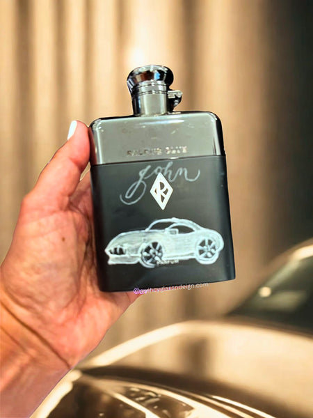 Custom engraved and hand-painted Ralph’s Club perfume bottle featuring a sleek silver sports car design in metallic detailing with a raised pearlescent outline. The bottle’s black matte base and chrome top reflect refined masculine luxury. Personalized engraving available for the groom, groomsmen, father of the bride, or father of the groom — a sophisticated bespoke gift handcrafted by A Wincy Glass ’N Design