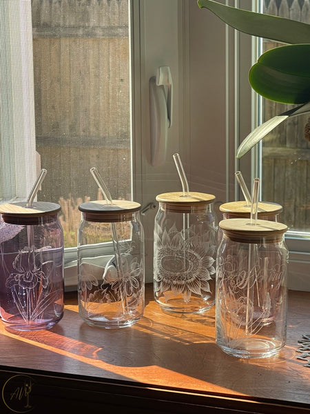 Collection of hand engraved glassware designs featuring floral and decorative illustration engraving