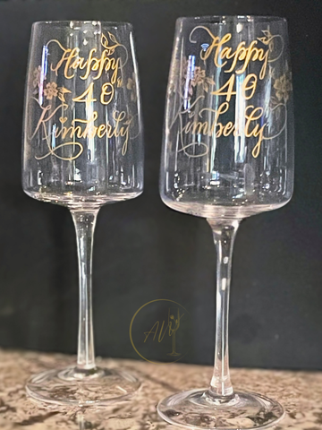 Personalized engraved wine glasses with gold calligraphy birthday design by A Wincy Glass N Design