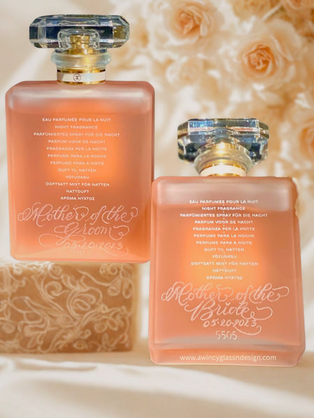 Engraved Coco Mademoiselle Chanel perfume bottles for weddings — personalized “Mother of the Bride” and “Mother of the Groom” keepsakes, bridal party gift, luxury bridal photo, soft champagne studio look.